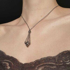 Classic vintage antique silver basket necklace with a small silver chain